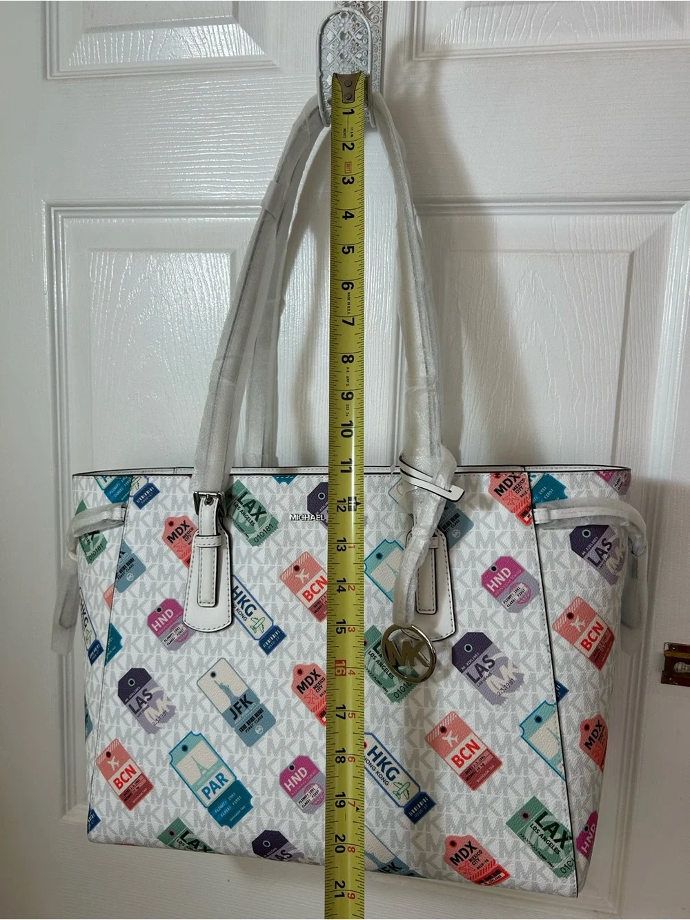 Michael Kors White Tote with Multicolor Luggage Tag Pattern